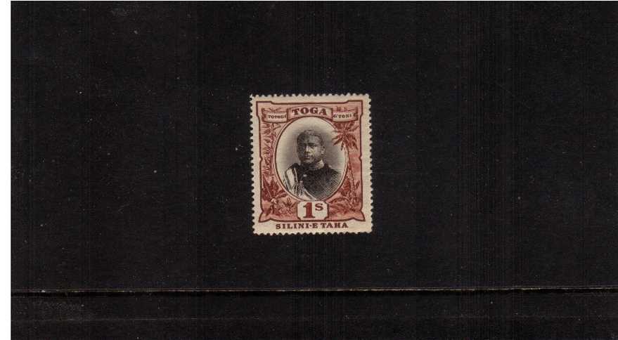 1/- Black and Red good mounted mint.<br/>A fresh well centered stamp showing the variety ''No hyphen before TAHA''.
<br/><b>ZKM</b>