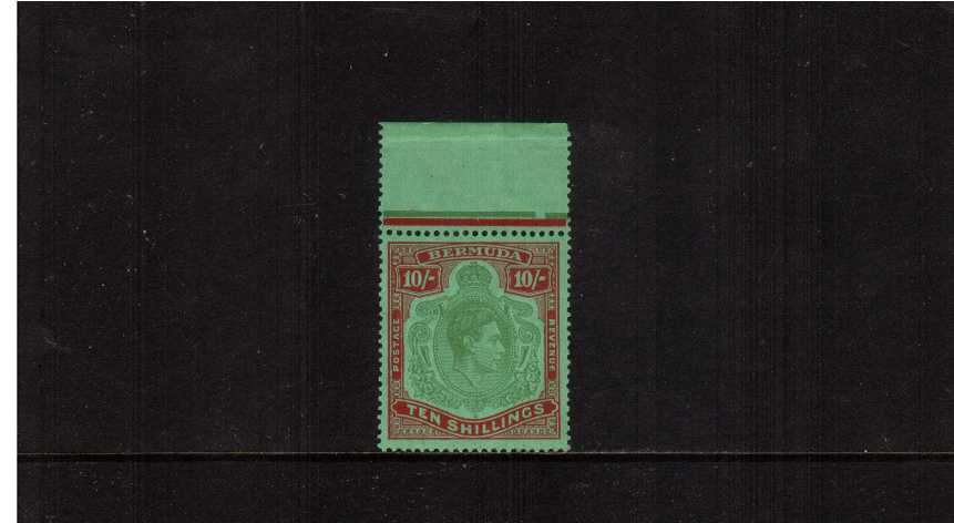 10/- Yellowish Green and Deep Carmine Red on Green - Ordinary Paper.<br/>
A top marginal unmounted mint stamp with tiny dealers mark on back. SG Cat �
<br/><b>AQG</b>