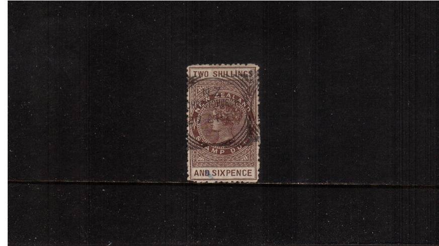 2/6d Grey-Brown - Perforation 12 Postal Fiscal<br/>
A good fine used single with usual rough perfs cancelled with an upright CHRISTCHURCH ''squared circle'' dated 27 AP 87. SG Cat 9.50 
<br/><b>QSQ</b>