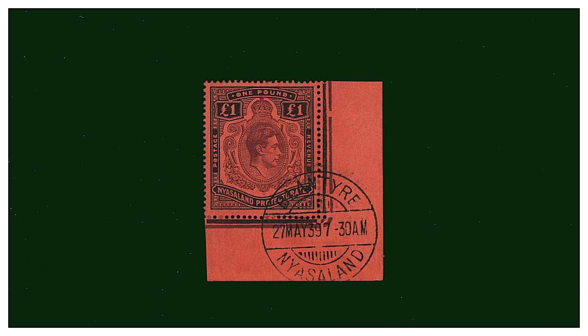£1 Purple and Black on Red.<br/>A stunning superb fine used sheet margin single from the SE corner cancelld with a crisp upright double ring CDS for BLANTYRE dated 27 MAY 39. A gem stamp! 
<br/><b>QQF</b>